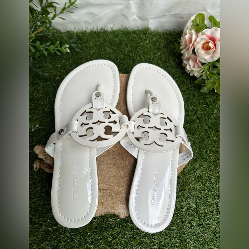 Tory Burch 
Miller cut-out leather flip-flops
$267 Sandals Sz 59 optical white - Picture 8 of 16